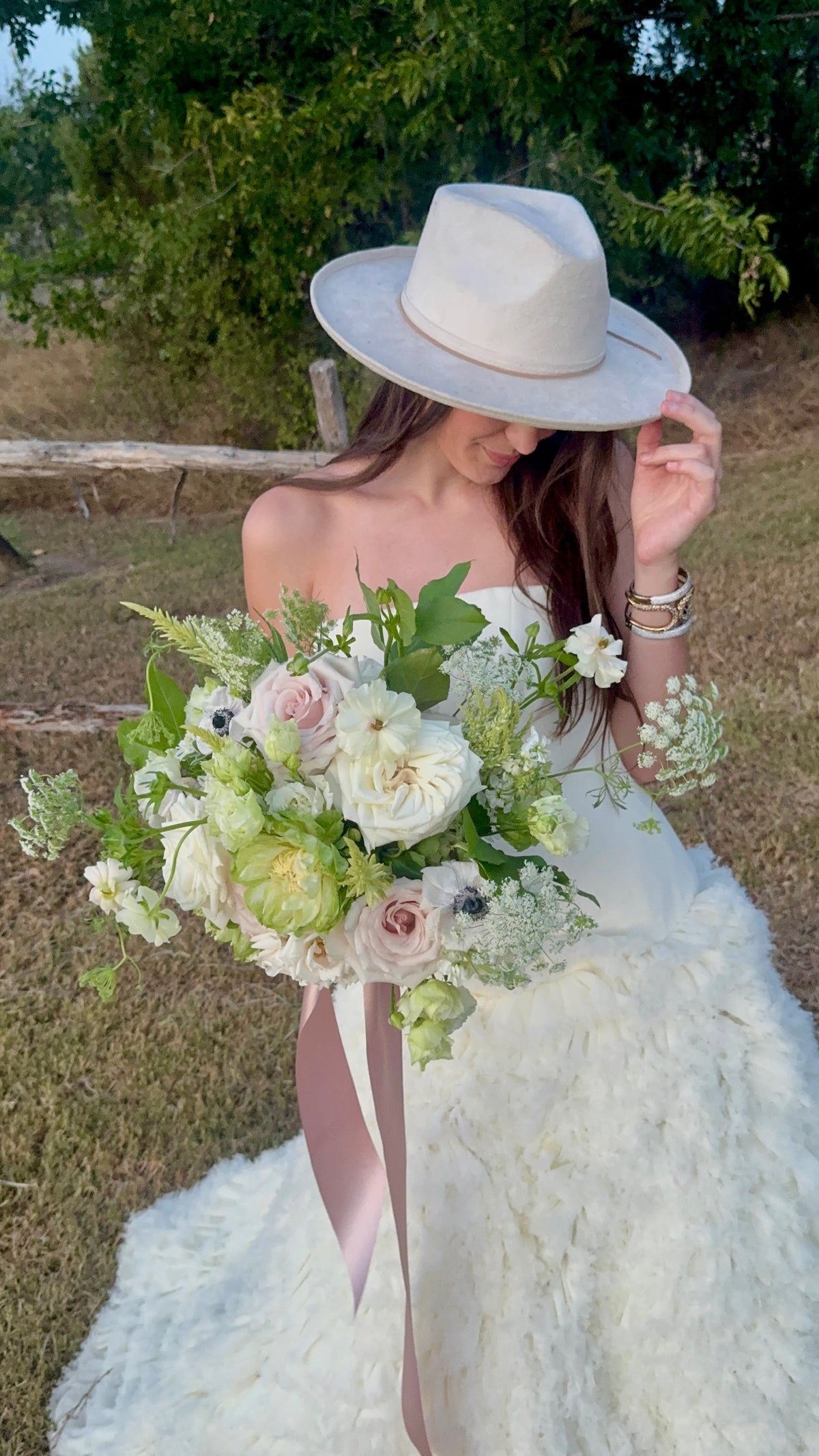 Bride holding a Golden Grove wedding bouquet