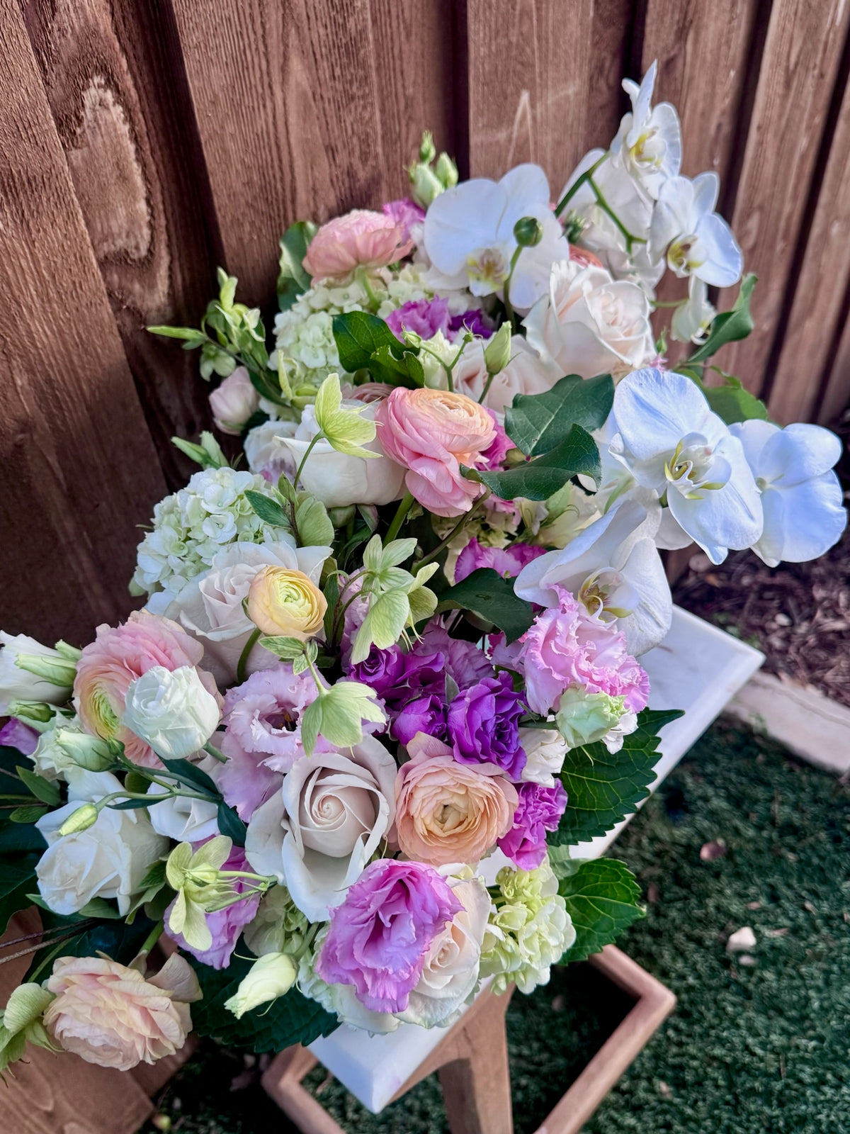 White and green Golden Grove floral arrangement