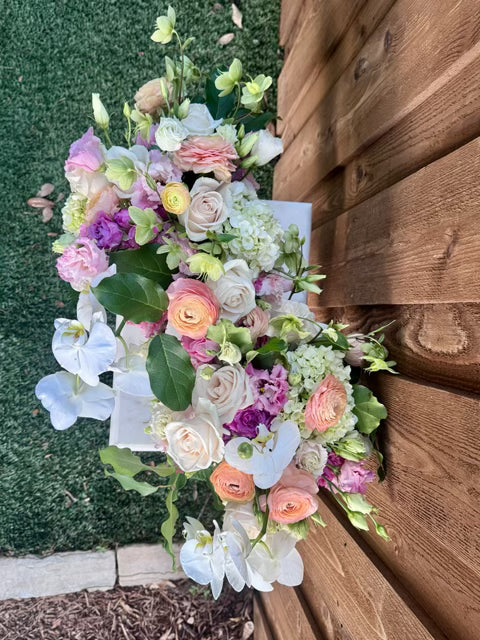 Bride holding a Golden Grove bouquet