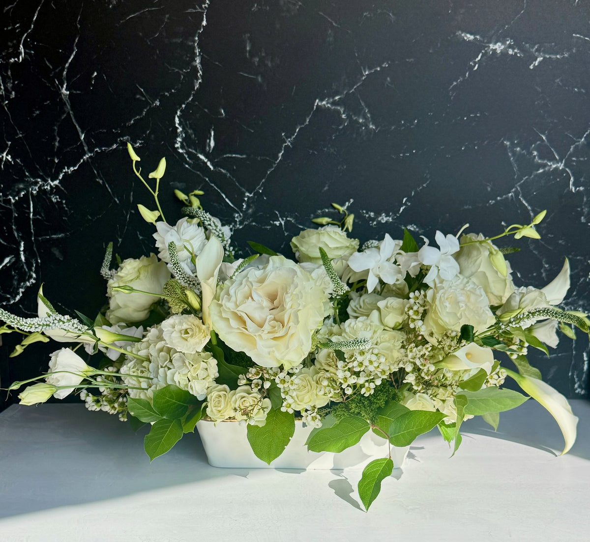 White garden-inspired floral arrangement by Golden Grove Floral Studio