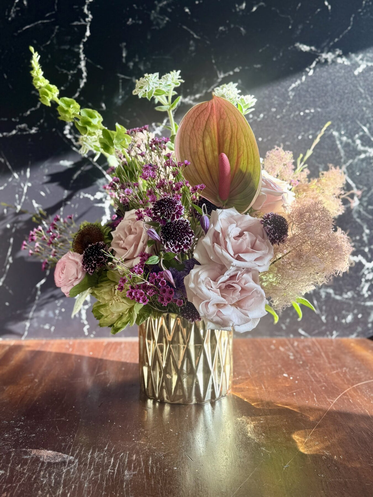 Golden Grove Muse Collection floral arrangement in a gold vase