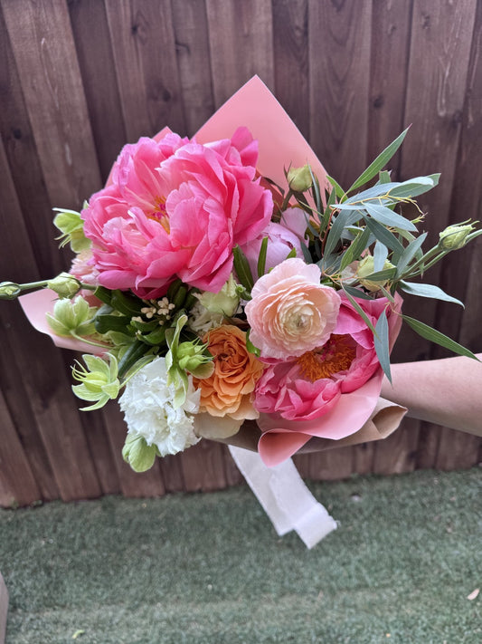 A vibrant pink hand-tied bouquet