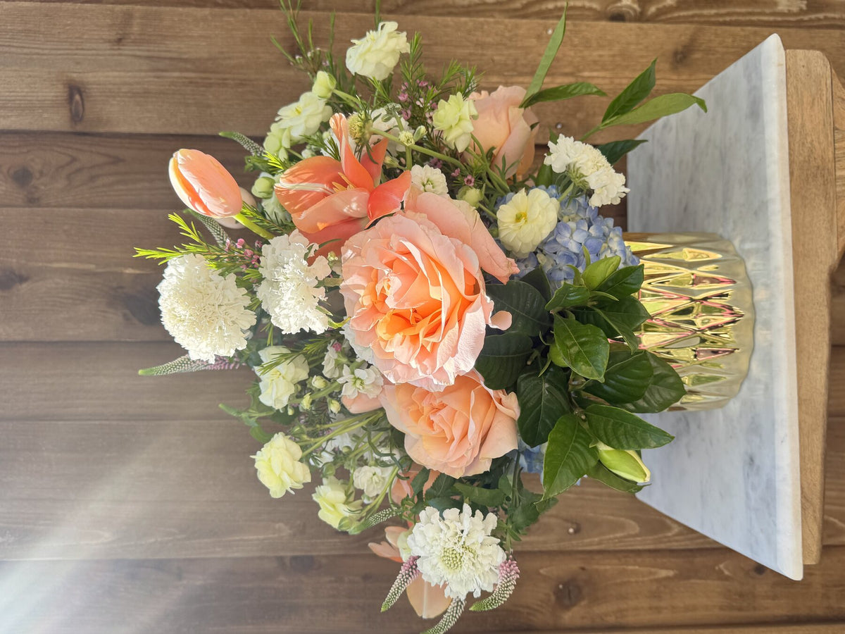 Peach and white Golden Grove floral arrangement
